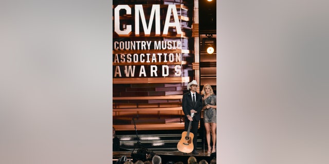 FILE - This Nov. 2, 2016 file photo shows hosts Brad Paisley, left, and Carrie Underwood at the 50th annual CMA Awards in Nashville, Tenn. The Country Music Association is warning media outlets to avoid questions about a recent mass shooting in Las Vegas, gun rights or political affiliations at their annual awards show next week or risk losing credentials. The 51st annual CMA Awards will air live on Wednesday. (Photo by Charles Sykes/Invision/AP, File)