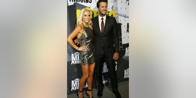 Luke Bryan and his wife Caroline are raising their two sons, their nephew and their two nieces. 