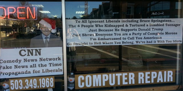 He put this giant sign in the window of his store in Lake Oswego, Oregon.