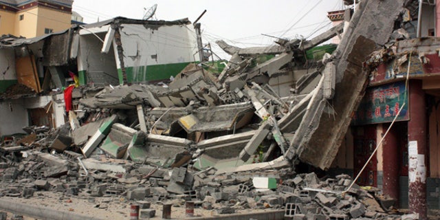 Apr. 14: A building is destroyed by the earthquake in Jiegu Town, western Qinghai Province, China.