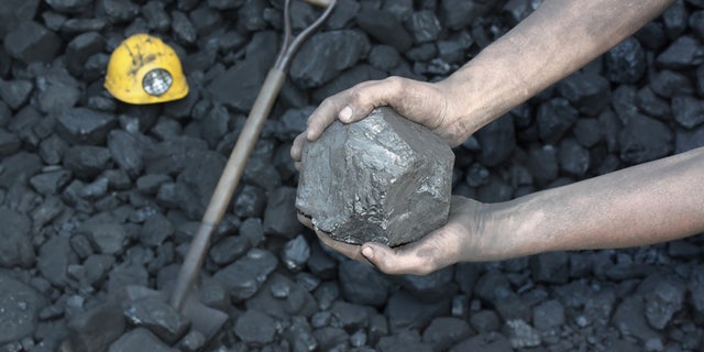 coal miner coal chunk istock