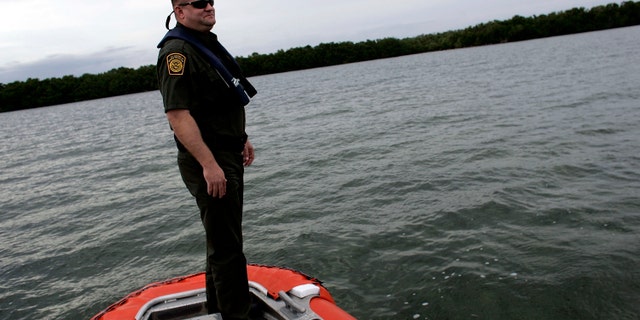 MARATHON, FL - JANUARY 30: U.S. Border Patrol agent Dan Schaefer rides on a Coast Guard boat as they look for possible boats smuggling humans on January 30, 2007 in Marathon, Florida. Along the Florida Keys the Border Patrol depends on interagency cooperation to help in their primary mission to detect and apprehend illegal aliens and smugglers trying to get into the United States. Some experts suggest that when Cuban President Fidel Castro dies there may be a mass migration to the United States with the Border Patrol on the front line trying to keep an orderly immigration process active. The Border Patrol also looks out for terrorists and terrorists weapons, as well as any other illegal activity. (Photo by Joe Raedle/Getty Images)