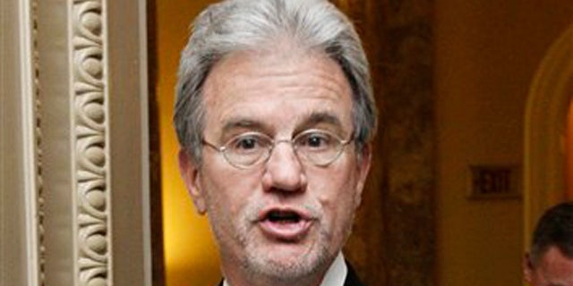 FILE: Nov. 29, 2011: Sen. Tom Coburn speaks to reporters on Capitol Hill, in Washington, D.C.