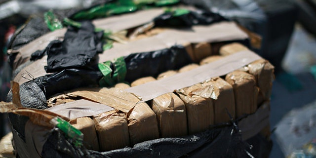 SAN DIEGO, CA - OCTOBER 6: Piles of confiscated cocaine, seized during a 18 different interdictions off the coast of Central and South America, is prepared to be offloaded from aboard the Cutter Boutwell at Naval Base San Diego on October 6, 2014 in San Diego, California. Operation Martillo offloaded more than 28,000 pounds of cocaine with a value of $423 million dollars wholesale. (Photo by Sandy Huffaker/Getty Images)