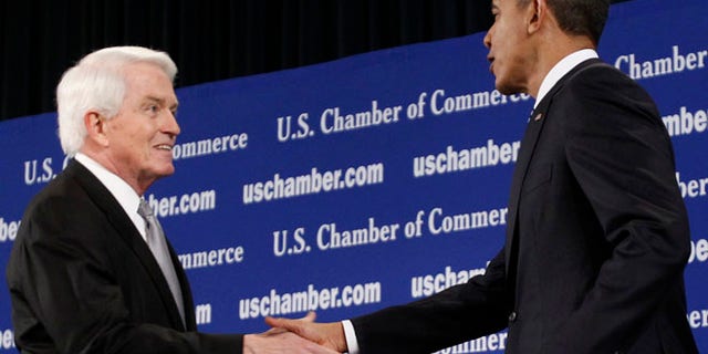 Feb 7. 2011: President Obama is greeted by Chamber of Commerce President Tom Donohue as he arrives to address the crowd in Washington. (Reuters)