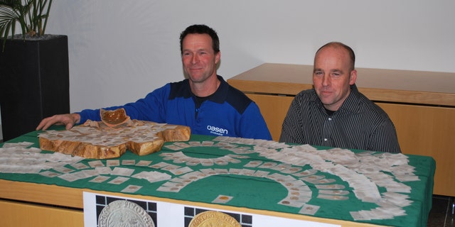 The trove of coins was found by construction workers laying a pipe.