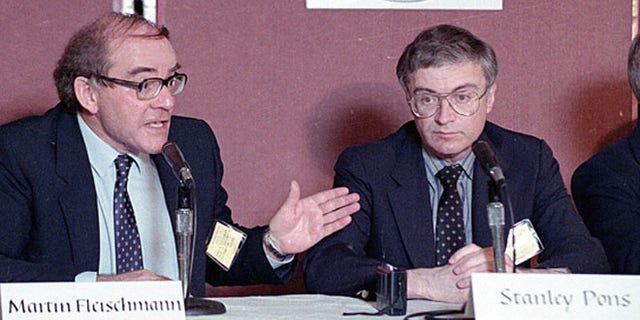 Martin Fleischmann, left, of the University of Southampton, England, talks to reporters about cold fusion as University of Utah chemist B. Stanley Pons listens, in Los Angeles, May 9, 1989. The pair of scientists claimed they have achieved nuclear fusion at room temperature.