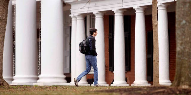 CHARLOTTESVILLE, VA - DECEMBER 6: Garrett Durig, a fourth year student at the University of Virginia, walks across campus on December 6, 2014 in Charlottesville, Virginia. (Photo by Jay Paul/Getty Images)