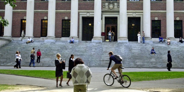 CAMBRIDGE, MA - OCTOBER 10: Students pass in front of Harvard's Widener Library on October 10, 2003 in Cambridge, Massachusetts. (Photo by William B. Plowman/Getty Images)