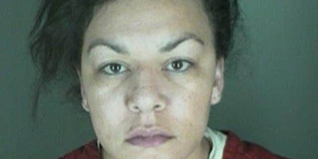 In this undated file photo, provided by the Longmont Police Department shows Dynel Lane, 34, who is accused of stabbing a pregnant woman in the stomach and removing her baby, while the expectant mother visited her home to buy baby clothes advertised on Craigslist authorities said.