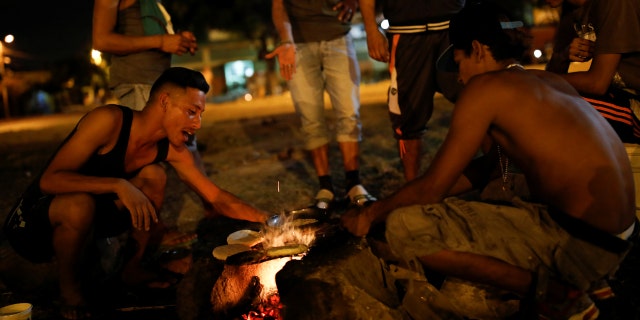 Venezuelan migrants cooking at a rec center in Cúcuta, Colombia, where they have taken shelter.