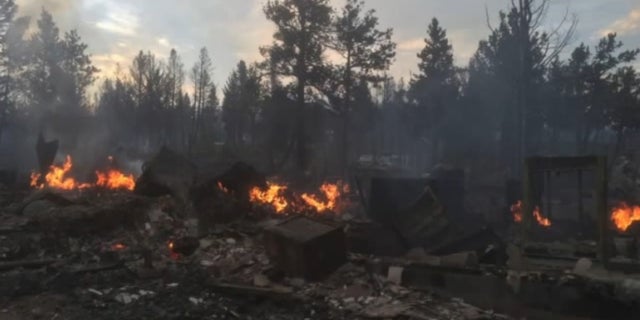 The smoldering remains of the Schmidtmanns' home.