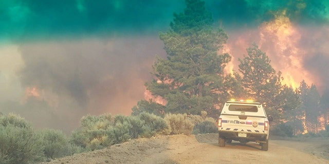 Photo shows an emergency vehicle June 27 during efforts to contain the Spring Creek Fire.