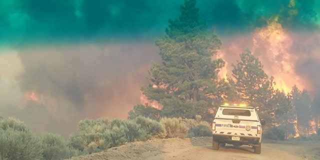 Photo shows an emergency vehicle June 27 during efforts to contain the Spring Creek Fire.
