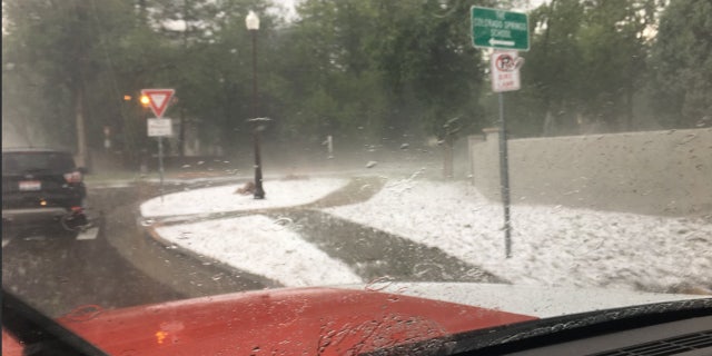 Large hail blanketed the area near the Cheyenne Mountain Zoo on Monday.
