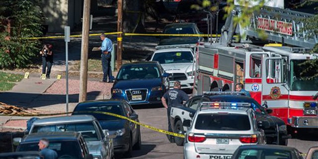 Oct. 31, 2015: Police investigate the scene after a series of shootings in Colorado Springs, Colo.