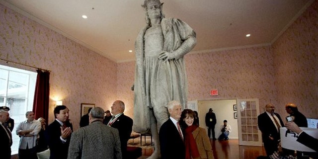 Guests stand in what is known as the living room created by artist Tatzu Nishi that surrounds Gaetano Russo's 1892 sculpture of Christopher Columbus 75 feet above Columbus Circle.