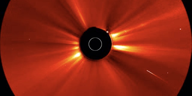 Soon after a huge solar storm erupted on May 20-21, 2011, a comet (bright streak at lower right) plunged into the sun. This shot is a still from a video taken by one of NASA's twin STEREO spacecraft.