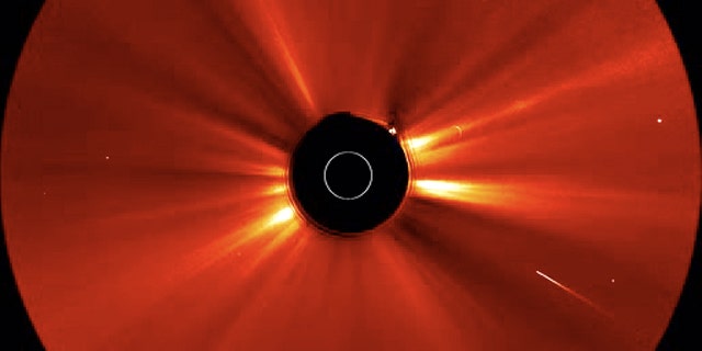 Soon after a huge solar storm erupted on May 20-21, 2011, a comet (bright streak at lower right) plunged into the sun. This shot is a still from a video taken by one of NASA's twin STEREO spacecraft.