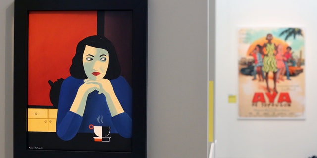 A painting by Iranian born French comics artist and film director Marjane Satrapi is presented as part of an exhibition on Comics and Immigration at the Museum of the History of Immigration in Paris, Monday Oct. 14, 2013.