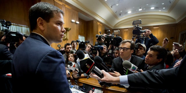 Sen. Marco Rubio speaks to reporters following a hearing on Cuba on Capitol Hill Tuesday, Feb. 3, 2015.