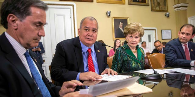 Rep. Gary Palmer, R-Ala., Del. Gregorio Kilili Camacho Sablan, D-Northern Mariana Islands, Del. Madeleine Bordallo, D-Guam, and Rep. Andy Barr, R-Ky., go before the House Rules Committee to prepare a bill for floor debate that would create a financial control board for Puerto Rico and restructure some of the U.S. territory's $70 billion debt, at the Capitol in Washington, Wednesday, June 8, 2016.