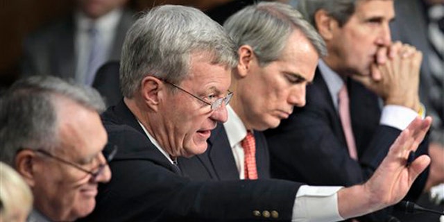 Oct. 26, 2011: Members of the deficit Super Committee meet on Capitol Hill. From left are Sen. Jon Kyl, Sen. Max Baucus, Sen. Rob Portman, and Sen. John Kerry.