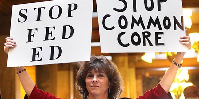 An opponent protests Common Core State Standards in Indianapolis. Indiana was the first state to back out of the national education standard. (AP)