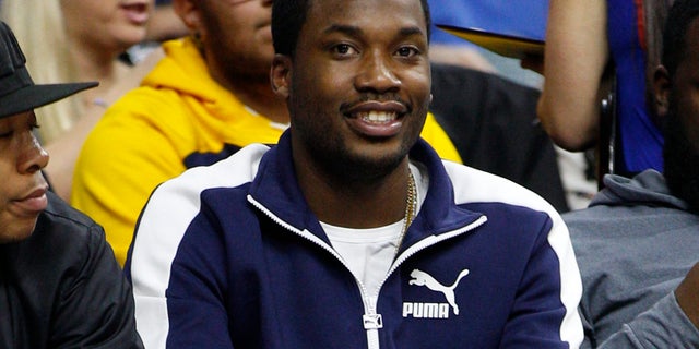 In this Wednesday, Feb. 3, 2016, photo, rapper Meek Mill looks on during the second half of an NBA basketball game between the Atlanta Hawks and the Philadelphia 76ers in Philadelphia.