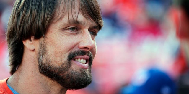 FILE - In this Nov. 15, 2015, file photo, former Denver Broncos quarterback Jake Plummer smiles on the sidelines during an NFL football game between the Broncos and the Kansas City Chiefs in Denver. If a compound found in hemp _ and its notorious cousin, cannabis _ proves as effective in treating brain injuries as testimonials claim, it would also be welcome news for the NFL on concussions, and even better for players. Along with a handful of other retired players, Plummer felt strongly enough about the benefits to appear in a public-service campaign titled When the Bright Lights Fade. (AP Photo/Jack Dempsey, File)