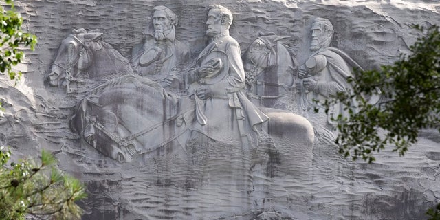 The carving depicts confederates Stonewall Jackson, Robert E. Lee and Jefferson Davis, in Stone Mountain, Ga.