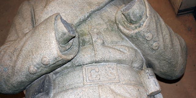The statue's hands and rifle were cut off.