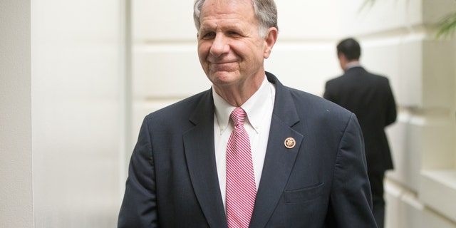 Rep. Ted Poe walks to a GOP meeting on Capitol Hill in December.