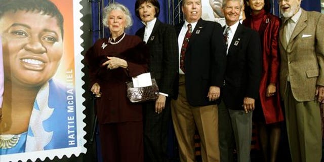In this Jan. 25, 2006 photo, Ann-Marie Johnson, National First Vice President of the Screen Actors Guild second from right, joins Gone With the Wind cast, from left: Ann Rutherford, Cammie King Conlon, Mickey Kuhn, Patrick Curtis and Fred Crane to celebrate actress Hattie McDaniel's stamp. (AP)