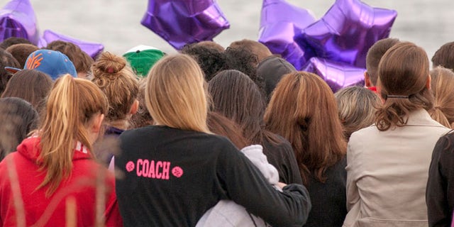 Apr. 25, 2014: People gather at the beach for a vigil in honor of murdered student Maren Sanchez in Milford, Connecticut.