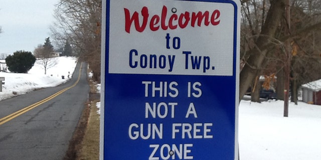 Signs marking the entry into the central Pennsylvania town of Conoy warn that the population may be armed. (Courtesy: Stephen Mohr)