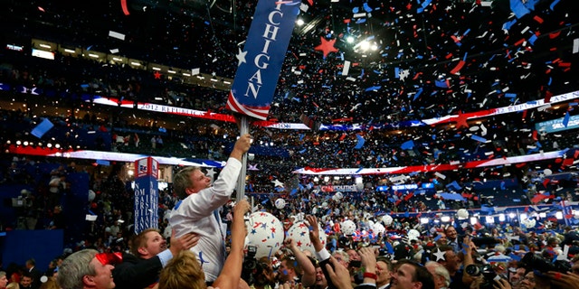 In this Aug. 30, 2012, file photo, Michigan delegates celebrate after Mitt Romney accepts the nomination at the Republican National Convention in Tampa, Florida. (REUTERS)