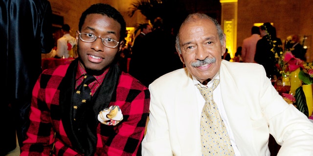 In this July 16, 2011 photo, John Conyers, III poses with his father Rep. John Conyers, D-Mich., in Detroit. John Conyers' resignation from the U.S. House amid sexual harassment allegations unlocks the seat he's held for more than a half-century. The 88-year-old endorsed his son, political neophyte John Conyers III. (Ricardo Thomas /Detroit News via AP)