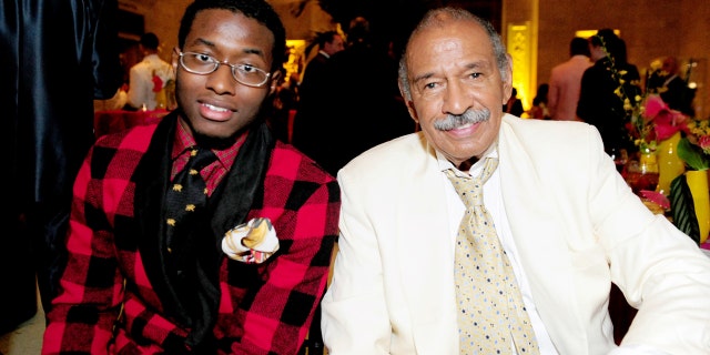 In this July 16, 2011 photo, John Conyers, III poses with his father Rep. John Conyers, D-Mich., in Detroit. John Conyers' resignation from the U.S. House amid sexual harassment allegations unlocks the seat he's held for more than a half-century. The 88-year-old endorsed his son, political neophyte John Conyers III. (Ricardo Thomas /Detroit News via AP)