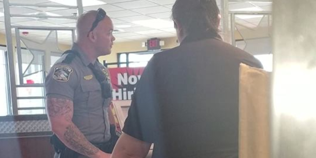 Horry County Police Officer CJ Mullinax is being hailed a hero for buying a homeless man a meal at Hardee's on May 26.