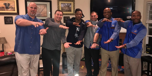 Jacob Copeland, center, pictured with the Florida Gators staff.