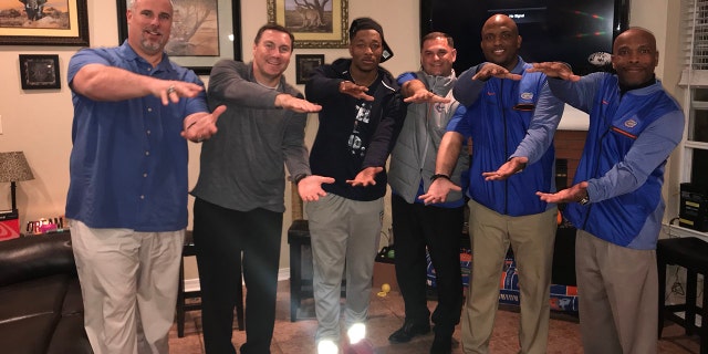 Jacob Copeland, center, pictured with the Florida Gators staff.