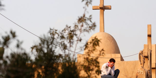 December 12, 2016: A man cries during the funeral of victims killed in the bombing of Cairo's Coptic cathedral, at the Mokattam Cemetery in Cairo, Egypt.