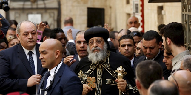 November 28, 2015: Egyptian Coptic Pope Tawadros II (C), head of the Coptic Orthodox church, arrives to the funeral of Anba Abraham, Coptic Archbishop of Jerusalem and the Near East, in Jerusalem's Old City. Tawadros' attendance comes after a decades-old ban on set by his predecessor, the late Pope Shenouda III.