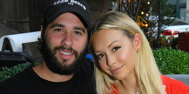 Olympios posed with her boyfriend while at the Morgan Clifford Fashion Week kick off dinner in New York on Wednesday.