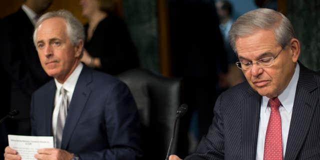 March 11, 2015: Senate Foreign Relations Committee Chairman Sen. Bob Corker, R-Tenn., left, and the committee's ranking member, Sen. Robert Menendez, D-NJ., prepare for the committee's hearing on Capitol Hill in Washington.