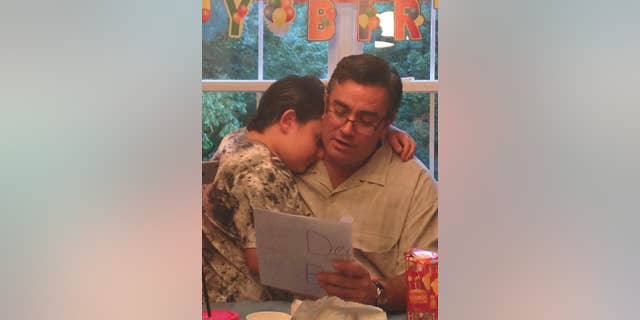 cornelius reading to autistic son facebook