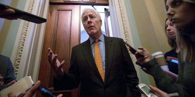 Sen. John Cornyn is working on bipartisan background check system legislation.