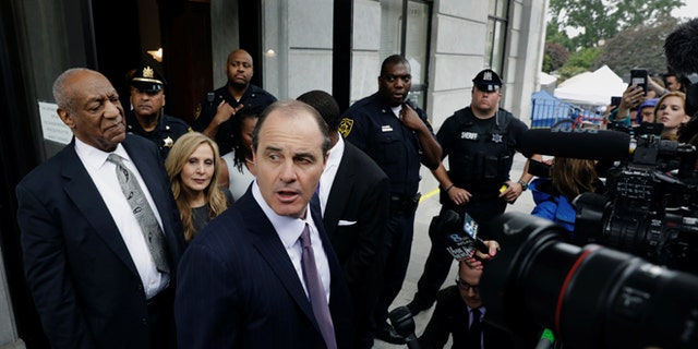 Actor and comedian Bill Cosby (L) stands as his attorney Brian McMonagle speaks after a judge declared a mistrial in his sexual assault trial at the Montgomery County Courthouse in Norristown, Pennsylvania, U.S., June 17, 2017. REUTERS/Lucas Jackson - RTS17H79