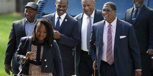 Bill Cosby, arrives with supporters, from left, Joe Torry and Lewis Dix, for his sexual assault trial at the Montgomery County Courthouse in Norristown, Pa., Thursday, June 8, 2017.